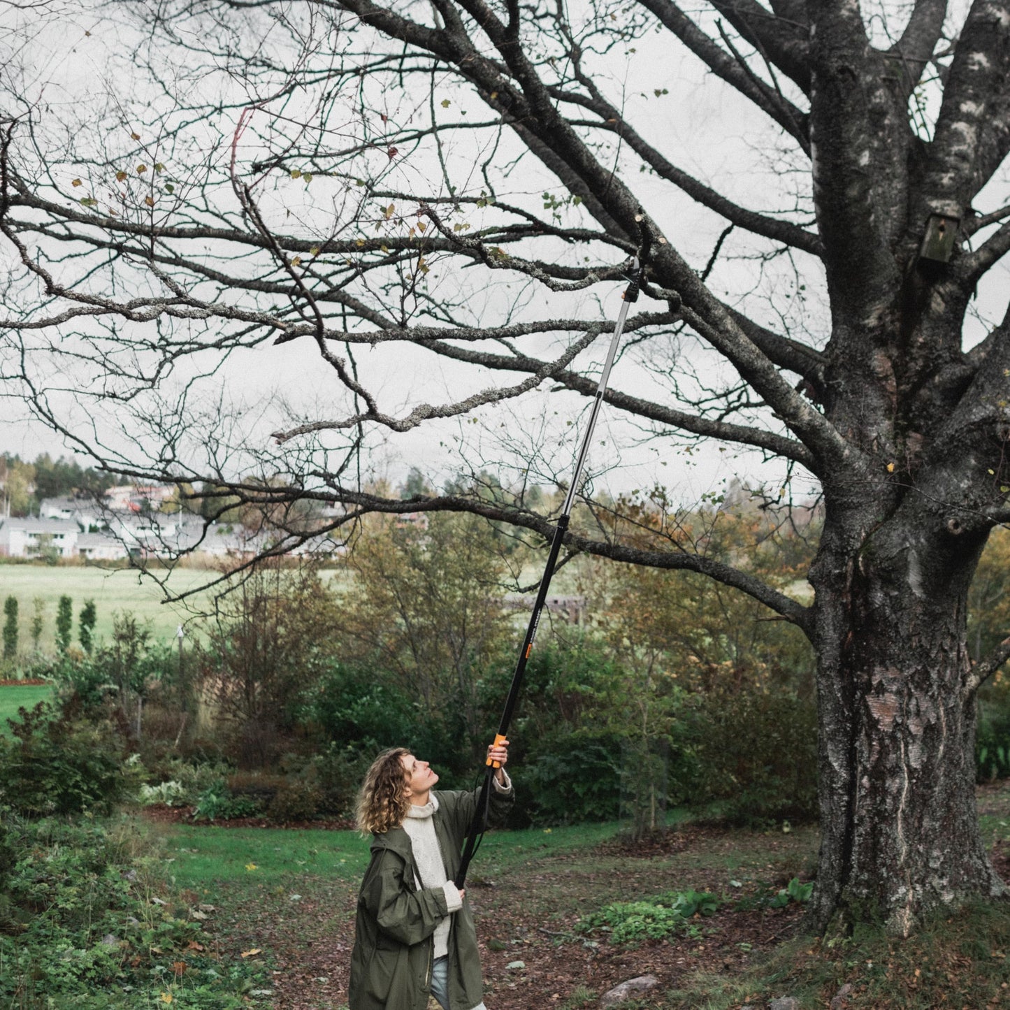 Fiskars 2-in-1 Extendable Tree Pruner and Pole Saw (Extends 7.9 - 12 feet) with Rotating Head, Pruning Stik Model with 15-Inch Double-Grind Saw Blade, and Double Locking System
