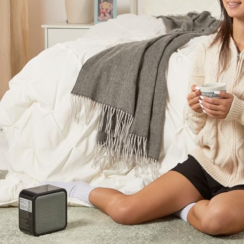 Amazon Basics Ceramic Space Heater, Mini Heater for Office Desk, Portable Tent Heater for Camping (Indoor Use), 500 W, With Tip-Over Protection, Lightweight (1.4 LBS), Black, 5.87”D x 3.15”W x 5.95”H
